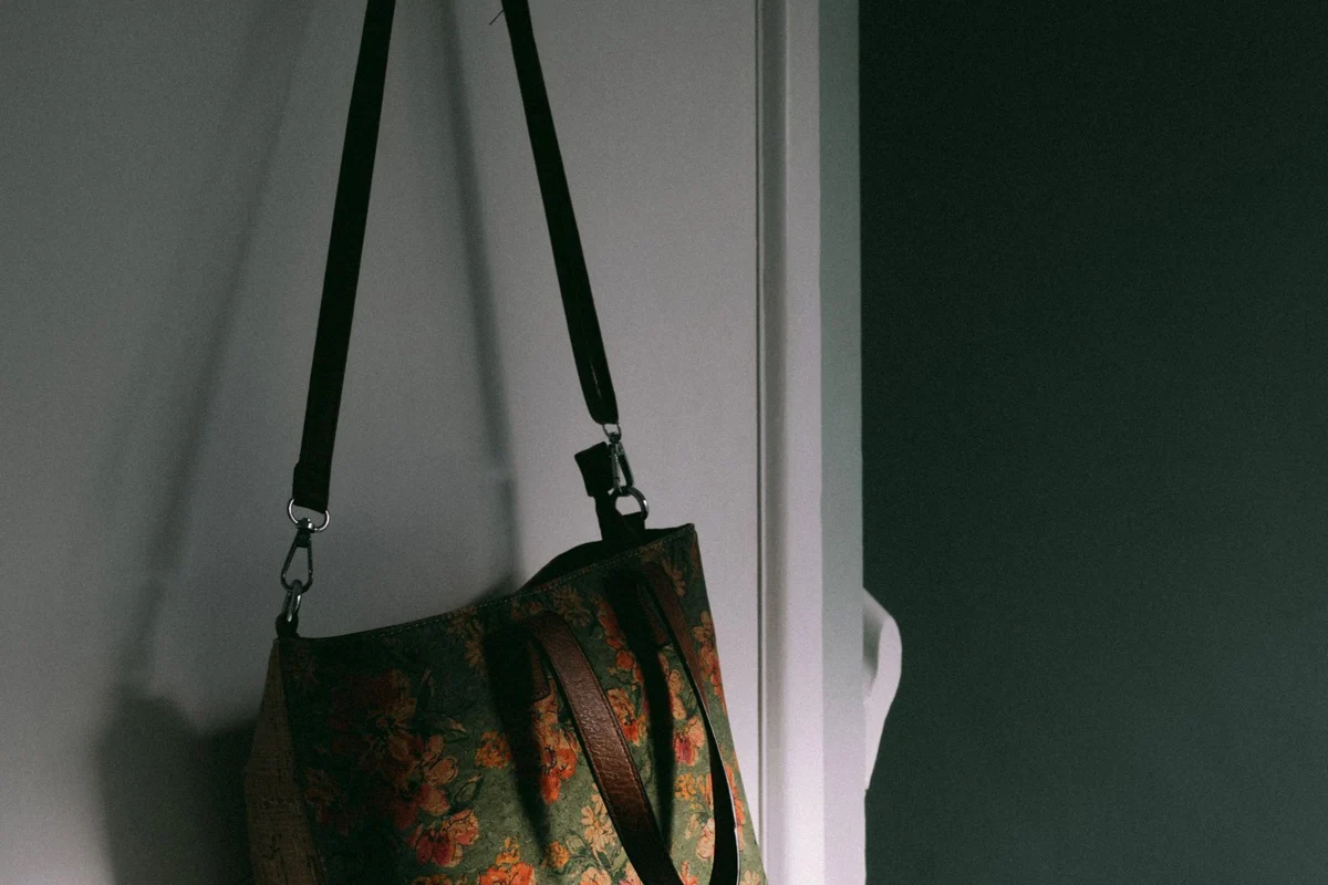 A fabric bag hanging from a door hook