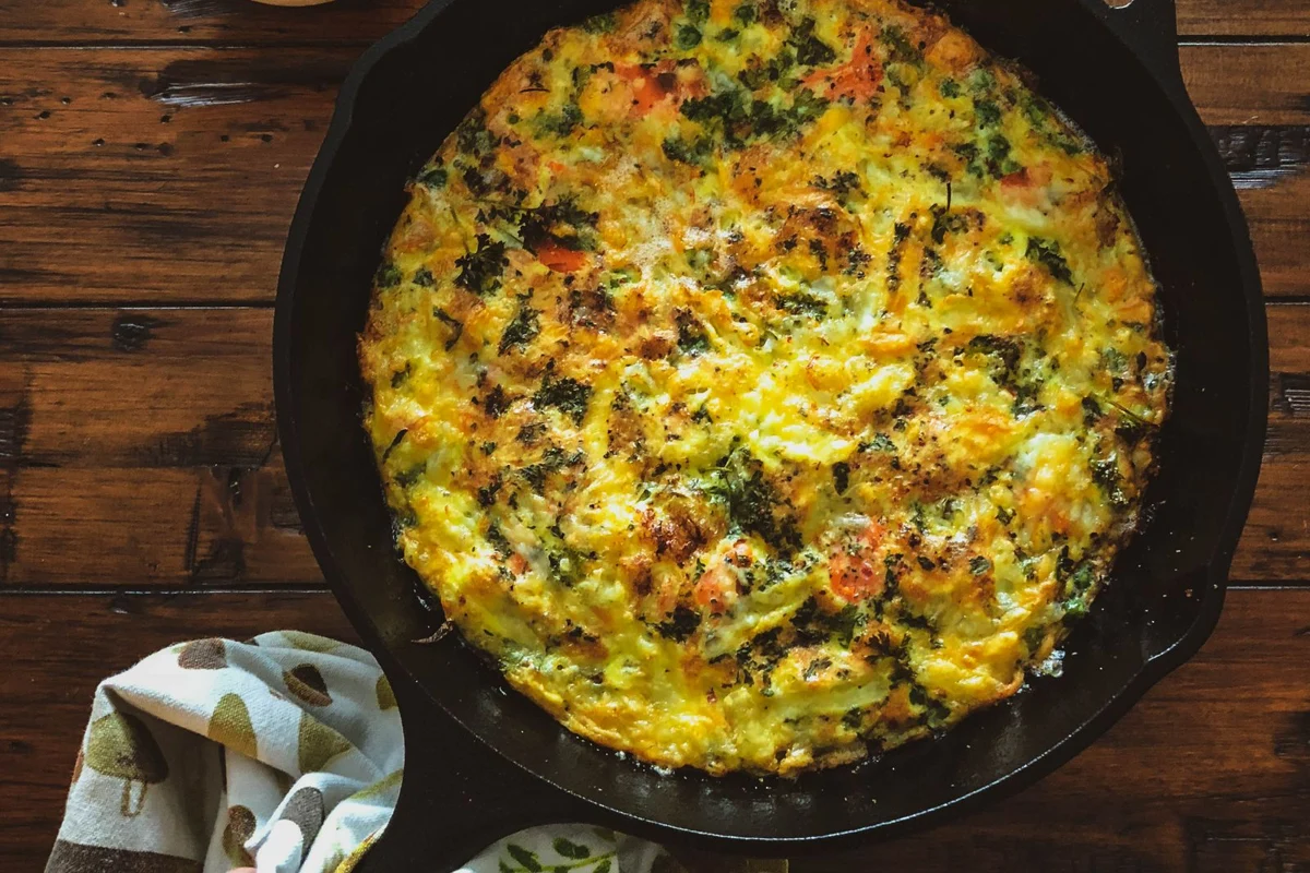 Food cooking in a cast iron skillet