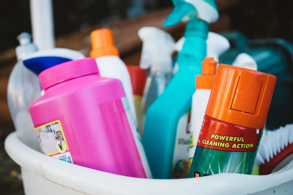 Cleaning supplies gathered in a bucket