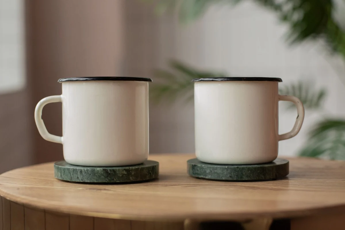 Two mugs on stone coasters