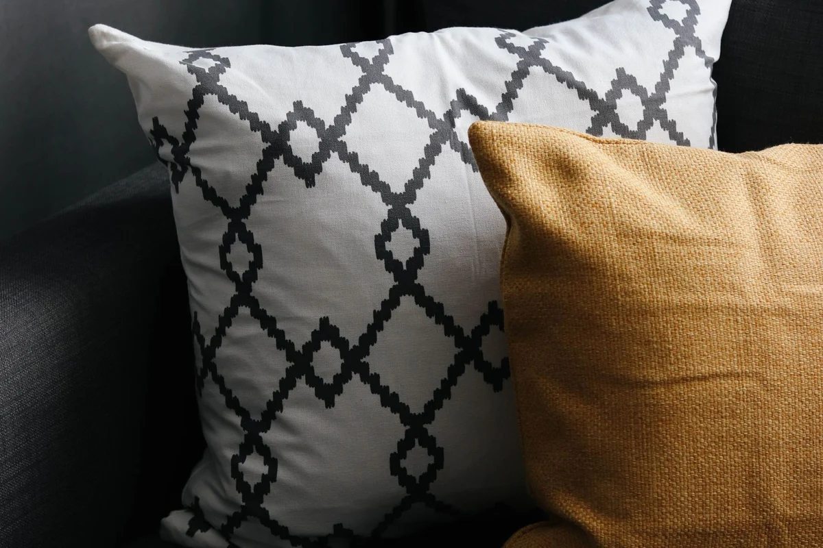 Different cushion covers arranged on a sofa