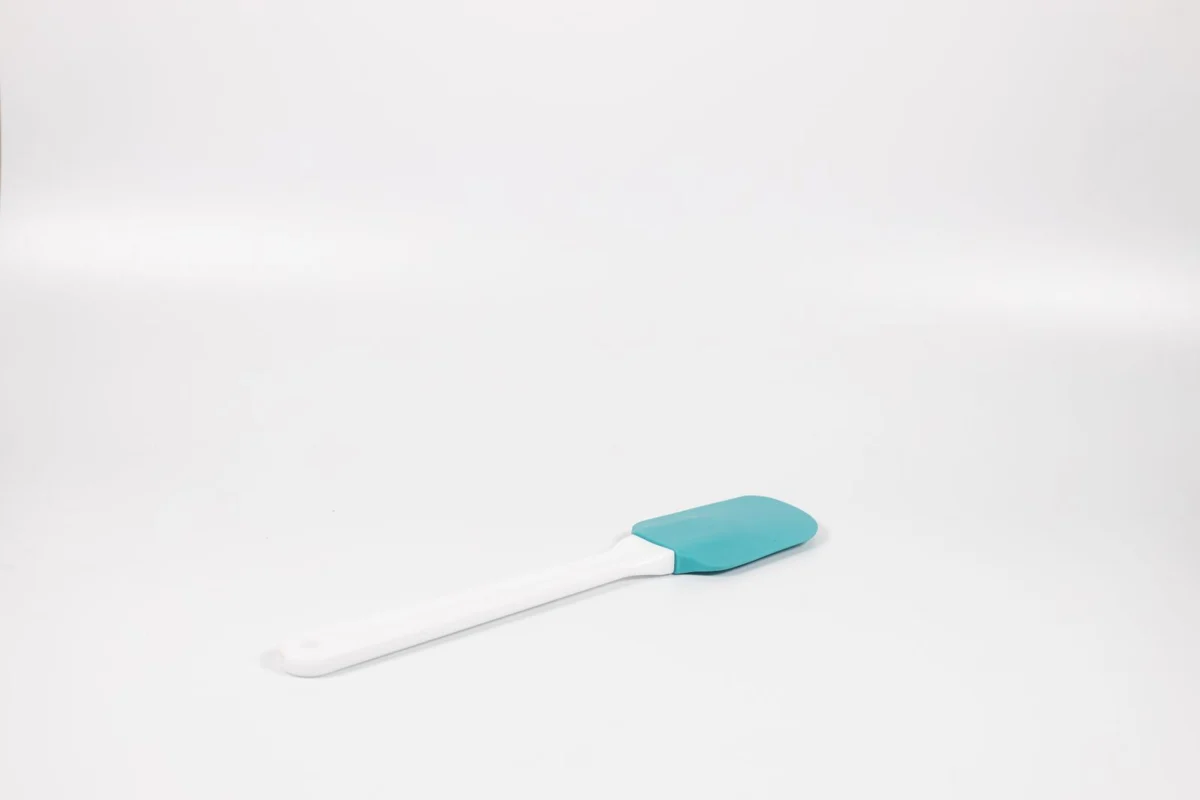 A silicone spatula on a plain surface