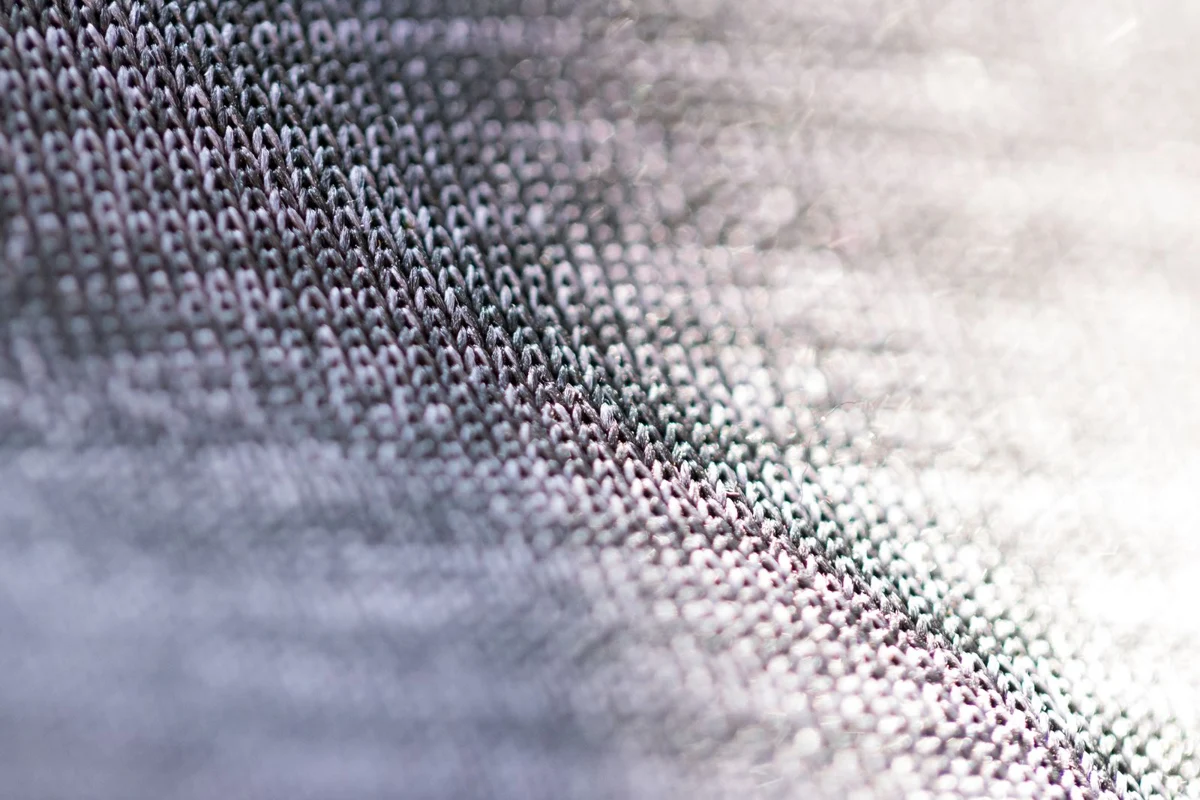 A close view of woven grey threads