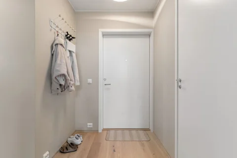An entrance hall with wall hooks