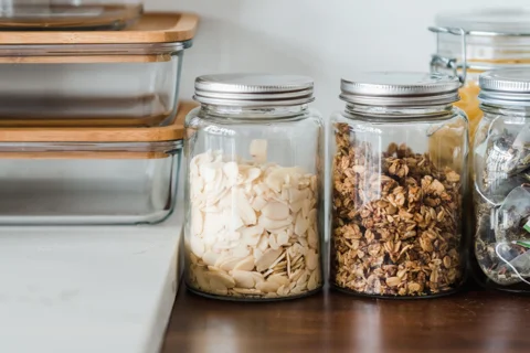 Food storage jars and containers on a kitchen counter