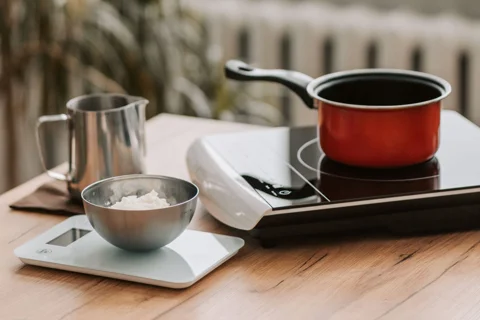 A cooking pot on a portable induction hob