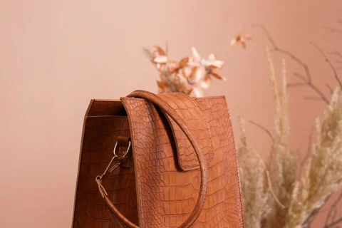 A leather handbag resting on a table
